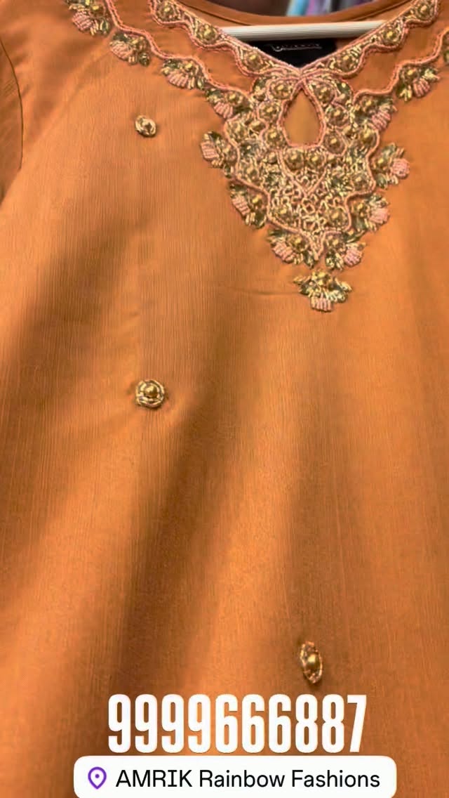 Original Instagram close-up of gold and pink hand embroidery on an orange Chinon suit